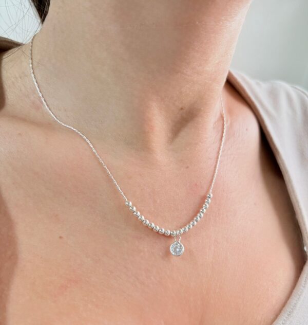 CONJUNTO de plata con dije con piedra blanca colgante