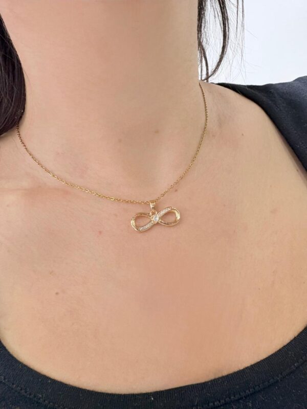 CONJUNTO de acero dorado diseño INFINITO