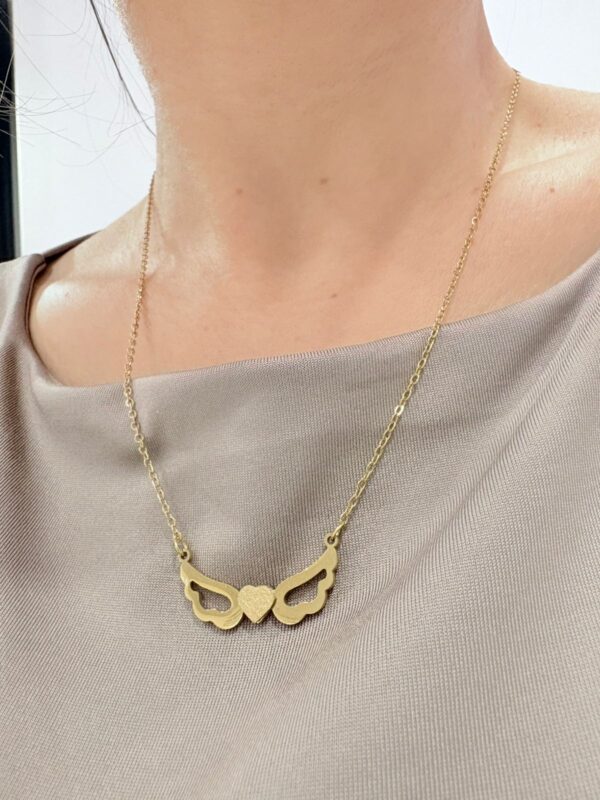 CONJUNTO de acero dorado diseño "CORAZÓN CON ALAS"