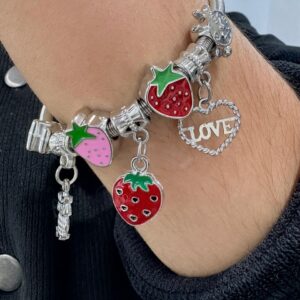 PULSERA de acero modelo con dijes varios, elastizada