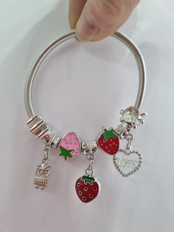 PULSERA de acero modelo con dijes varios, elastizada - Image 2
