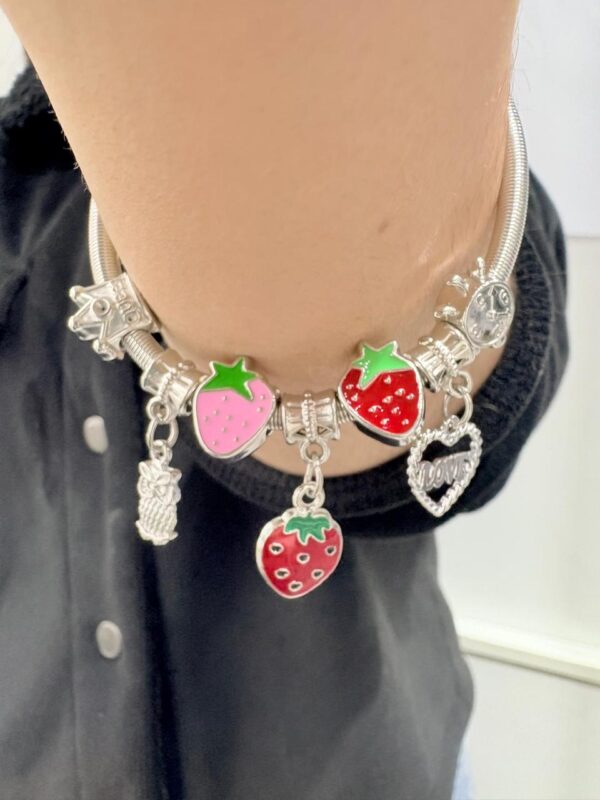 PULSERA de acero modelo con dijes varios, elastizada - Image 3