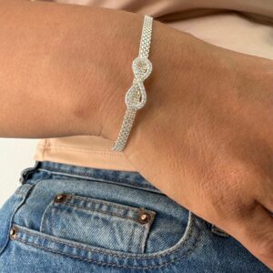 PULSERA DE PLATA RODINADA MODELO INFINITO CON PIEDRAS