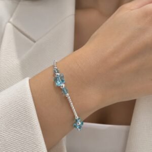 PULSERA DE PLATA CON CRISTAL EUROPEO MODELO TREBOLES COLOR CELESTE